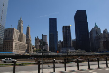 Obraz premium city, skyline, buildings, manhattan, new york, building, skyscraper, cityscape, sky, downtown, architecture, panorama, urban, business, view, usa, new, travel, chicago, nyc, america, clouds, york, sun
