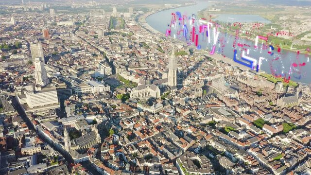 Inscription on video. Antwerp, Belgium. Flying over the roofs of the historic city. Schelde (Esco) river. Cathedral of Our Lady of Antwerp. (Onze-Lieve-Vrouwekathedraal Antwerpen). Glitch effect text