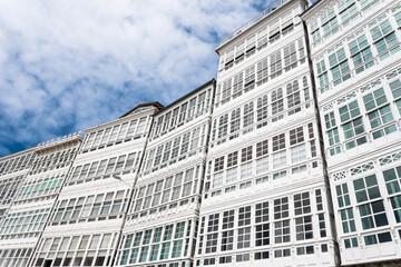 Fototapeta premium Low angle of white facades with glazed balconies on Avenida de Marina, A Coruña, Galicia