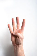 man hand on white background pointing four with fingers.