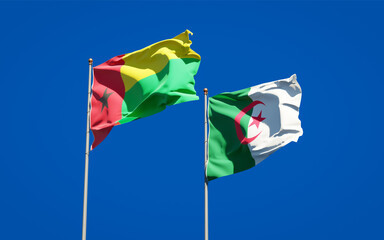 Beautiful national state flags of Algeria and Guinea-Bissau together at the sky background. 3D artwork concept.