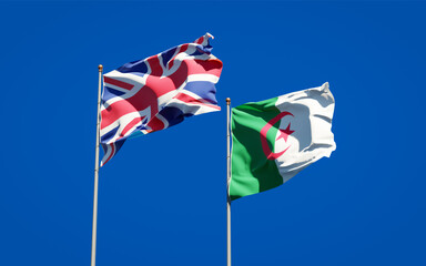 Beautiful national state flags of UK and Algeria together at the sky background. 3D artwork concept.