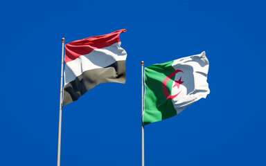 Beautiful national state flags of Yemen and Algeria together at the sky background. 3D artwork concept.