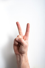 man hand on white background pointing two with fingers.
