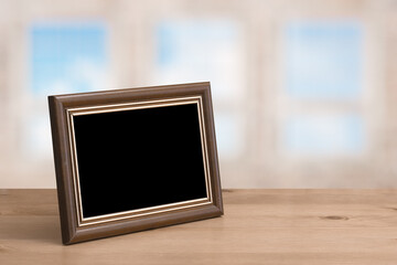 old photo frame on the wooden table