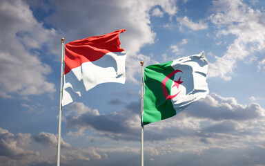 Beautiful national state flags of Indonesia and Algeria together at the sky background. 3D artwork concept.