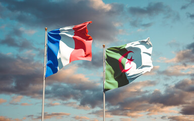 Beautiful national state flags of France and Algeria together at the sky background. 3D artwork concept.