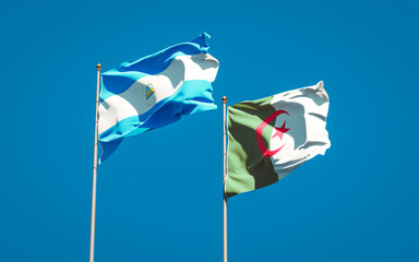 Beautiful national state flags of Nicaragua and Algeria together at the sky background. 3D artwork concept.