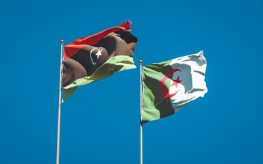 Beautiful national state flags of Libya and Algeria together at the sky background. 3D artwork concept.