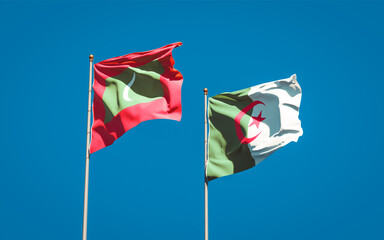 Beautiful national state flags of Maldives and Algeria together at the sky background. 3D artwork concept.