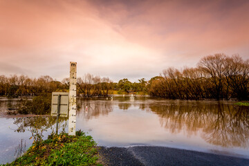 Road cut by flood waters in Australia - 391461937