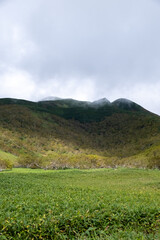 View of cloudy mountain ranges by Lake Rausu