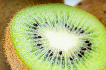 Close up of a healthy kiwi fruit, macro studio shot of green kiwi