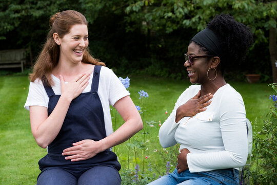 Therapist and client placing hands on their chest and stomach, EFT touching therapy.