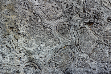 wavy texture in old worn concrete wall