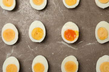 Flat lay with boiled eggs on gray background, top view