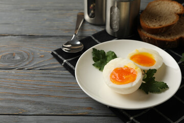 Concept of breakfast with boiled eggs on wooden background