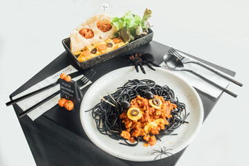 Black spaghetti with white background