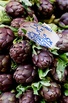 High angle close up of artichokes on market stall, Bologna, Emilia-Romagna, Italy.