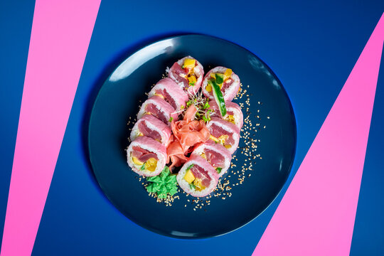 Pink Sushi with Tuna with soya paper on blue and pink background