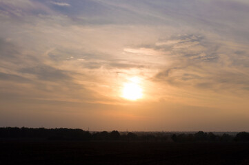 Naklejka na ściany i meble Landscape photo, field at sunset time