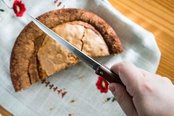 Homemade cake over a beautiful cloth and knife