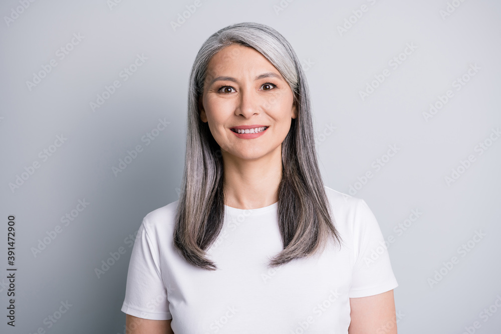 Sticker photo of calm pensioner old lady look camera smile wear white t-shirt isolated grey color background