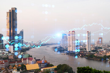 Fototapeta premium Forex and stock market chart hologram over panorama city view of Bangkok, the financial center in Asia. The concept of international trading. Double exposure.