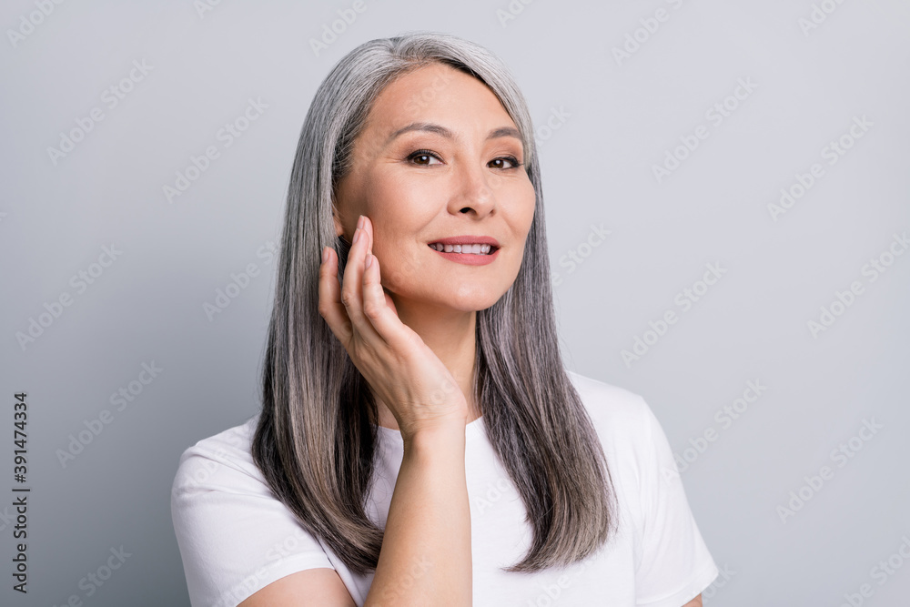 Sticker photo portrait of senior woman with grey hair touching cheek wearing white t-shirt smiling isolated 