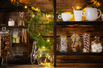 Christmas decoration cocoa bar with cookies and sweets on old wooden background in  natural rustic style. Winter cozy concept