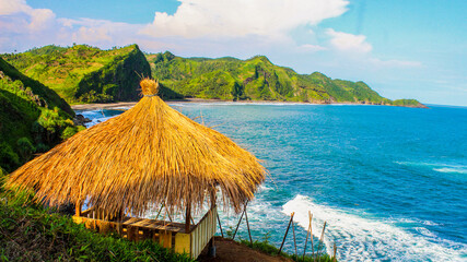 One of the visitors' favorite small huts on the edge of the Tanjung Menguneng cliff, Karang Duwur Village,