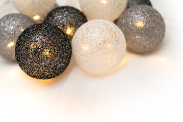 Christmas glowing garland. Balls of threads.