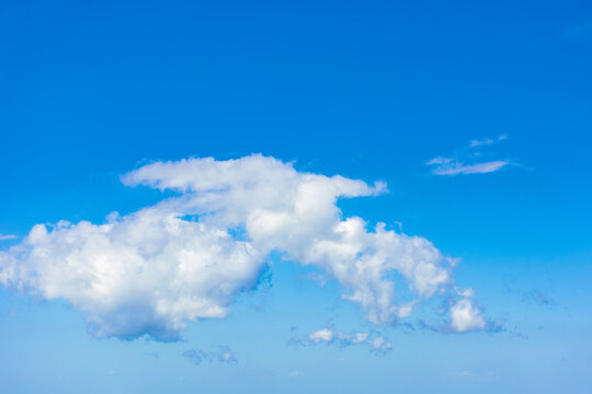 white fluffy clouds on the blue sky. beautiful nature background