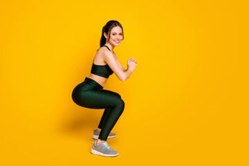 Fototapeta na wymiar Full length body size profile side view of her she nice pretty cheerful girl doing sit-ups training isolated over bright yellow color background
