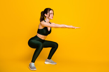 Full length body size profile side view of her she nice motivated girl doing sit-ups exercise isolated bright yellow color background