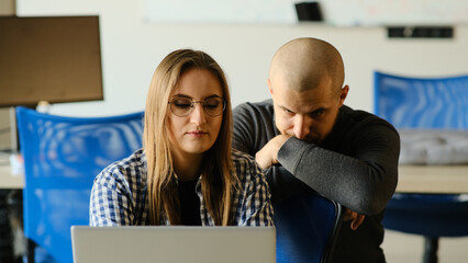 Girl and boyfriend working on computer, teamwork process.