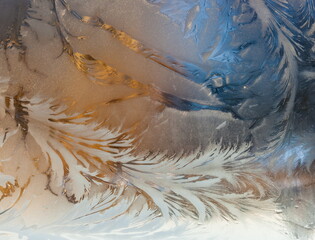 .the frosty patterns on the window.