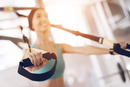 The Smile Girl Does Exercises On Uneven Bars.