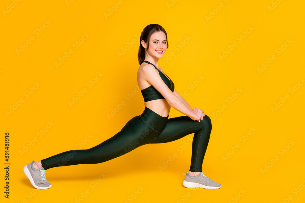 Canvas Prints photo of sportive young lady fitness stretching sit one leg wear sports suit top pants sneakers isol