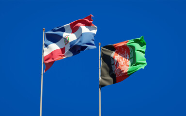 Beautiful national state flags of Afghanistan and Dominican Republic together at the sky background. 3D artwork concept.