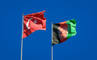 Beautiful national state flags of Turkey and Afghanistan together at the sky background. 3D artwork concept.