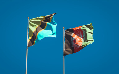 Beautiful national state flags of Tanzania and Afghanistan together at the sky background. 3D artwork concept.