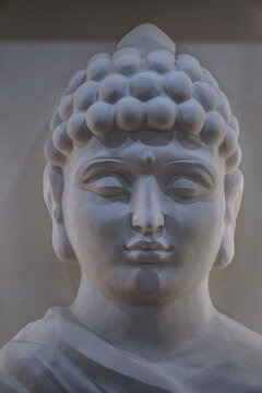 Sculpture of a bust of a Buddha. Eastern god in Buddhism. India and Sri Lanka beliefs