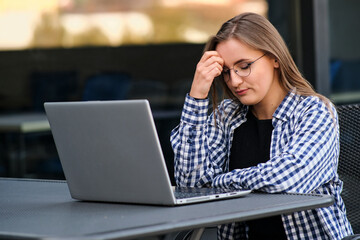 The programmer girl works at the computer	Girls in science. In an empty office during a pandemic.