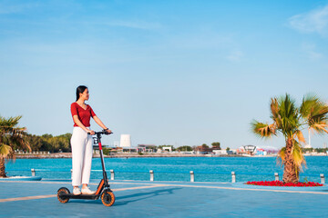 Woman having a ride on electric scooter for transportation © creativefamily