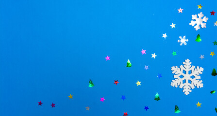 Xmas greeting card. Christmas and New Year holiday background. Snowflakes, stars, Christmas toys.  Flat lay