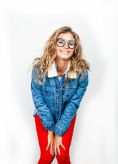 young pretty blond teenage hipster girl in glasses posing emotional happy smiling, gesturing isolated on white background, lifestyle poeple concept