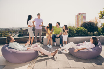 Full body photo of crowd of positive friends communicating tell to each other sit of soft chair...