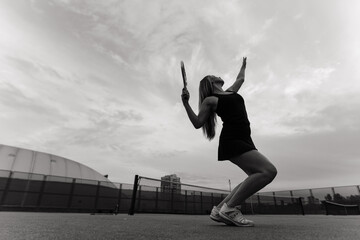 Fototapeta na wymiar Tennis tournament. Female player at the clay tennis court