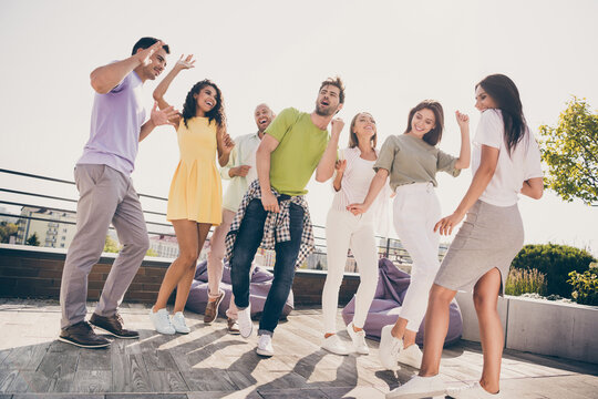 Photo of chilling pretty girls handsome guys have fun dancing party on roof terrace outside